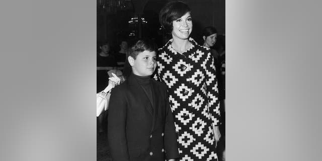 Mary Tyler Moore puts her arm around her son, Richard Meeker Jr.