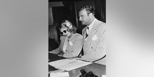 (Original Caption) Mrs. "Bogie" isn't anymore...Mrs. Humphrey Bogart, shown with attorney Paul Ralli, was awarded a divorce from actor Humphrey Bogart. Mrs. Bogart is Mayo Methot of the movies. Actress Lauren Bacall and Bogart have announced that they will soon be wed.