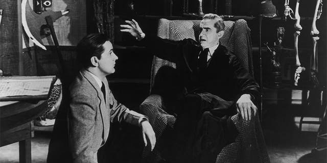 Wood talks to actor Bela Lugosi on the set of the film