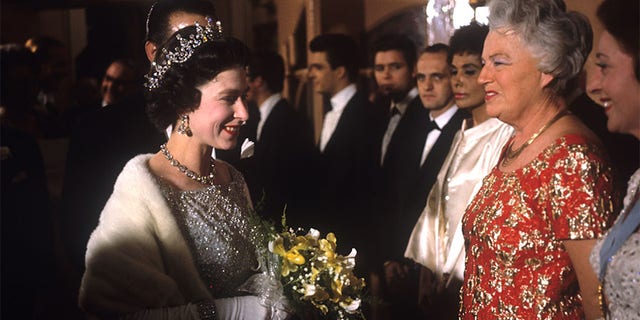 Queen Elizabeth II talks to actress and singer Gracie Fields before the Royal Variety Performance at the London Palladium.