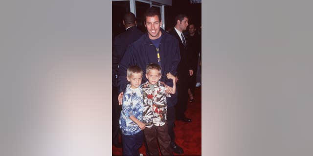 Adam Sandler with twins Cole and Dylan Sprouse at the premiere of "Big Daddy" in 1999.