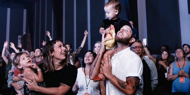 The Heiligenthal family. Olive, who died Saturday, sits on her father Andrew's shoulder.