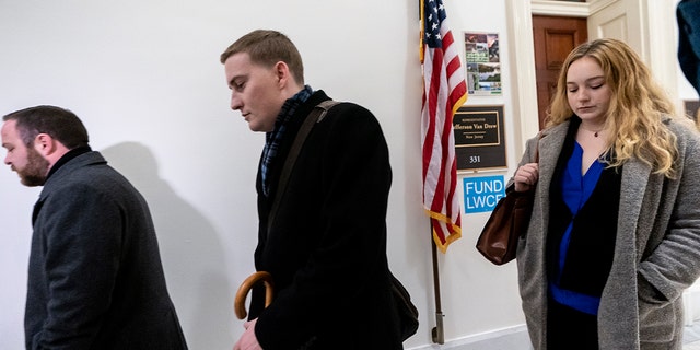 Deputy Chief of Staff Justin O'Leary, center, joins other top aides to New Jersey Rep. Jeff Van Drew, a House Democrat who plans to switch and become a Republican, as leave their office after turning in their joint letter of resignation, on Capitol Hill in Washington, Monday, Dec. 16, 2019. (Associated Press)