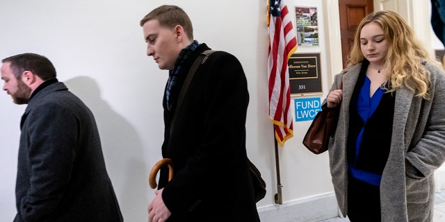 Deputy Chief of Staff Justin O'Leary, center, joins other top aides to New Jersey Rep. Jeff Van Drew, a House Democrat who plans to switch and become a Republican, as leave their office after turning in their joint letter of resignation, on Capitol Hill in Washington, Monday, Dec. 16, 2019. (Associated Press)