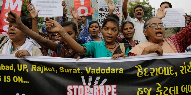 People shout slogans condemning rising cases of rape and violence against women during a protest in Ahmadabad, India, Monday, Dec. 2, 2019. (AP Photo/Ajit Solanki)
