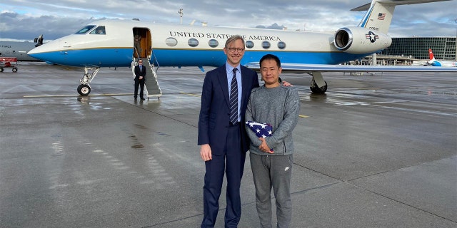 Xiyue Wang and Brian Hook, the US State Department's Iran Specialist, have fun after Wang is released from Iranian prison.