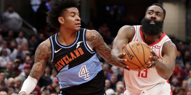 Houston Rockets' James Harden (13) drives past Cleveland Cavaliers' Kevin Porter Jr. (4) in the second half of an NBA basketball game, Wednesday, Dec. 11, 2019, in Cleveland. Houston won 116-110. (AP Photo/Tony Dejak)