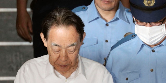 US News In this June 3, 2019, file photo, Hideaki Kumazawa, left, a former top Japanese government official, leaves a police station in Tokyo.