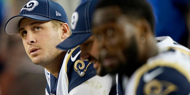 Los Angeles Rams quarterback Jared Goff, left, sits on the bench with teammates during the second half of the team's NFL football game against the San Francisco 49ers in Santa Clara, Calif., Saturday, Dec. 21, 2019. (AP Photo/Tony Avelar)