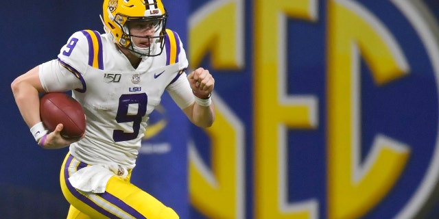 FILE - In this Dec. 7, 2019, file photo, LSU quarterback Joe Burrow (9) runs against Georgia during the second half of the Southeastern Conference championship NCAA college football game, in Atlanta. Burrow is a unanimous selection as the offensive player of the year on The Associated Press All-Southeastern Conference football team, Monday, Dec. 9, 2019. (AP Photo/Mike Stewart, File)