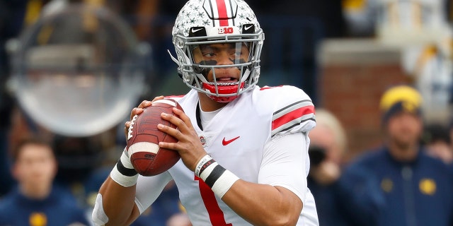 Ohio State quarterback Justin Fields throws against Michigan in the first half of an NCAA college football game in Ann Arbor, Mich., Saturday, Nov. 30, 2019. (AP Photo/Paul Sancya)
