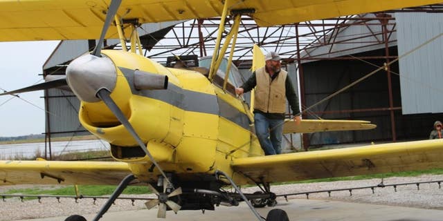 A crop duster was loaded with 100 gallons of holy water to be sprayed onto the town of Cow Island, La., and nearby farms. 