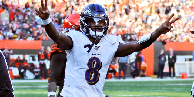 Baltimore Ravens quarterback Lamar Jackson celebrates a 12-yard touchdown pass to running back Mark Ingram during the second half of an NFL football game against the Cleveland Browns, Sunday, Dec. 22, 2019, in Cleveland. (AP Photo/Ron Schwane)