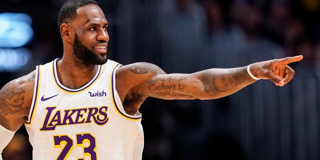 Los Angeles Lakers forward LeBron James was helping the students of his I Promise School in Ohio. (AP Photo/Jack Dempsey)