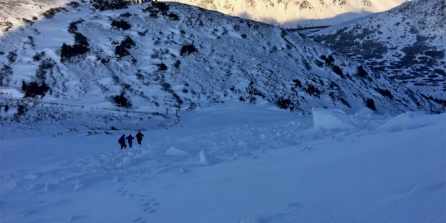 The hiker was fully buried, but had been able to kick his feet out from the snow.