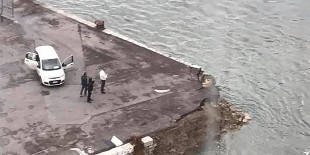 The 1,085-foot ocean liner collided with a port as it moved to dock on the Italian island.