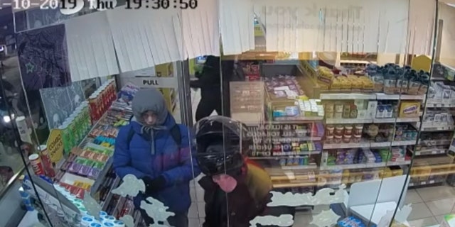 The group of men could be seen stealing items from the gas station.