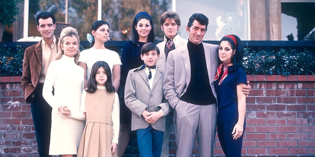Entertainer Dean Martin with his wife Jeanne and children (Gail, Craig, Claudia, Deana, Gina, Ricci and Dean Paul) pose for a family portrait in 1966 in Los Angeles, California.