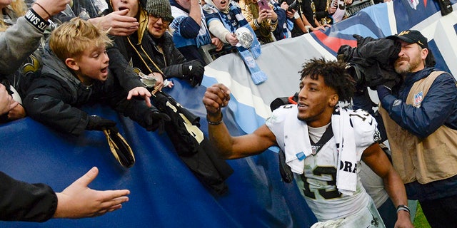 New Orleans Saints wide receiver Michael Thomas signs autographs after an NFL football game against the Tennessee Titans Sunday, Dec. 22, 2019, in Nashville, Tenn. The Saints won 38-28.
