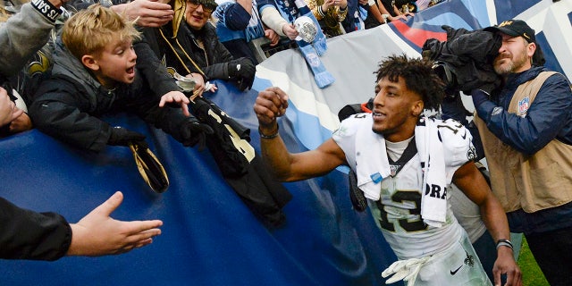 New Orleans Saints wide receiver Michael Thomas signs autographs after an NFL football game against the Tennessee Titans Sunday, Dec. 22, 2019, in Nashville, Tenn. The Saints won 38-28.