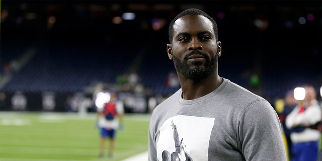 HOUSTON, TEXAS - DECEMBER 01: Former quarterback Michael Vick looks on prior to the game between the New England Patriots and the Houston Texans at NRG Stadium on December 01, 2019 in Houston, Texas. (Photo by Bob Levey/Getty Images)