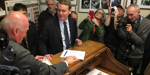 Sen. Michael Bennet of Colorado files to place his name on New Hampshire's primary ballot last month in Concord.