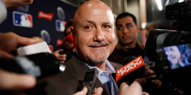 Washington Nationals general manager Mike Rizzo speaks with members of the media as he arrives for the premiere of a documentary film on the team's first World Series baseball championship, Monday, Dec. 2, 2019, in Washington. (AP Photo/Patrick Semansky)