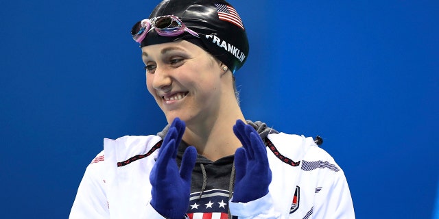 In this Aug. 11, 2016 file photo United States' Missy Franklin wears gloves as she prepares for a women's 200-meter backstroke semifinal during the swimming competitions at the 2016 Summer Olympics in Rio de Janeiro, Brazil. (AP Photo/Lee Jin-man, file)