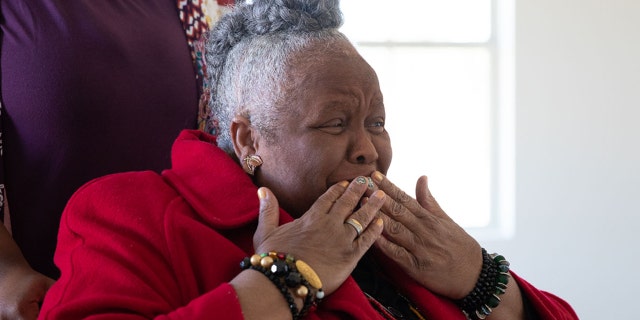 Earnestine Reese reacts to her new home that was rebuilt by Samaritan's Purse after it was destroyed in March by two tornadoes.