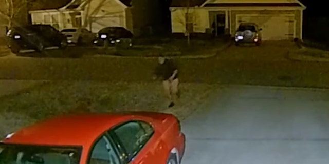 The ma appeared to be half-clothed while running across a street and into a backyard, where he crouched next to a grill.