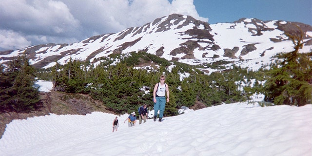 Kristin Snyder and friends hiking on a mountain.