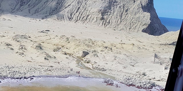 This Dec. 9, 2019, photo provided by Auckland Rescue Helicopter Trust shows ash-covered White Island, New Zealand, following the eruption of the volcano.