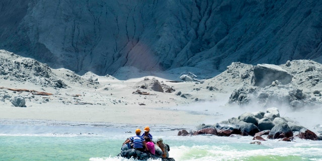 This Monday, Dec. 9, 2019, photo provided by Michael Schade shows the rescuers' boat leaving White Island following the eruption of the volcano, New Zealand. Michael Schade via AP