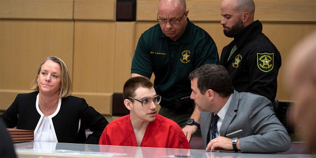 Nikolas Cruz with attorney Gabe Ermine in Judge Elizabeth Scherer's courtroom at the Broward County Courthouse on Dec. 19 in Fort Lauderdale, Fla. (Michael Laughlin/South Florida Sun-Sentinel via AP, Pool)