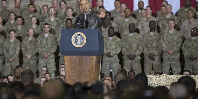 President Barack Obama addresses US troops during a surprise visit to Bagram Air Field, north of Kabul, in Afghanistan, May 25, 2014, prior to the Memorial Day holiday.