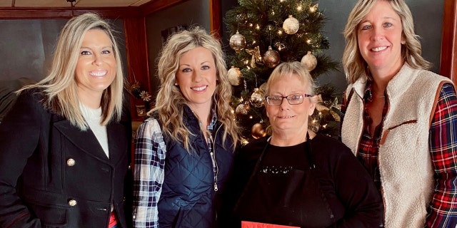 Jessica Greb (center left), the founder of Orchestrating Good, told Fox News that she and others gave a $1,300 tip to waitress Michele Bachmann (center right).