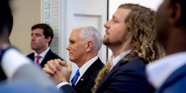 Vice President Mike Pence and Sean Feucht, a worship leader who is running for Congress in California, participate in a faith briefing at the White House complex Friday.