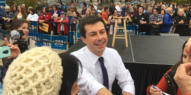 Democratic presidential candidate and South Bend, Indiana Mayor Pete Buttigieg shakes hands with voters after filing to place his name on New Hampshire's primary ballot, in Concord, NH on Oct. 30, 2019