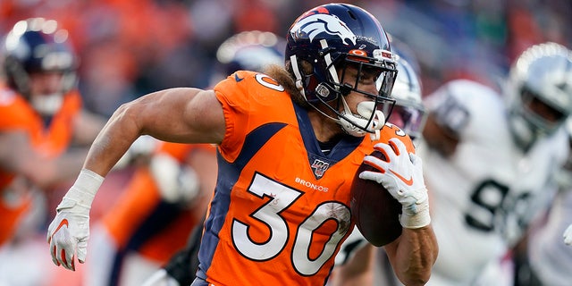 Denver Broncos running back Phillip Lindsay runs with the ball during the second half of an NFL football game against the Oakland Raiders, Sunday, Dec. 29, 2019, in Denver. (AP Photo/Jack Dempsey)