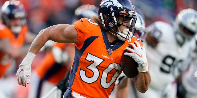 Denver Broncos running back Phillip Lindsay runs with the ball during the second half of an NFL football game against the Oakland Raiders, Sunday, Dec. 29, 2019, in Denver. (AP Photo/Jack Dempsey)