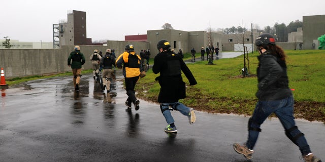 People running during a drill at the Foreign Affairs Security Training Center in Blackstone, Virginia. The newly-opened center is designed to train overseas workers how to respond to security threats and embassy attacks. (Fox News)