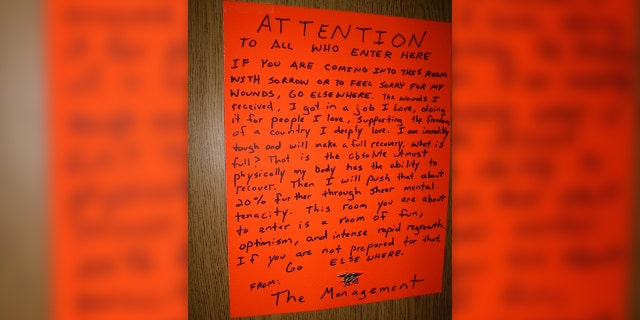 The sign Redman posted after his surgery at the Bethesda Naval Hospital in late-September 2007. It went on to become a national statement and symbol for wounded warriors across the country. The original sign was signed by then-President George W. Bush and framed at the Walter Reed National Military Medical Center.