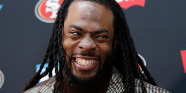 FILE - In this Oct. 20, 2019, file photo, San Francisco 49ers cornerback Richard Sherman speaks at a news conference after an NFL football game against the Washington Redskins, in Landover, Md.