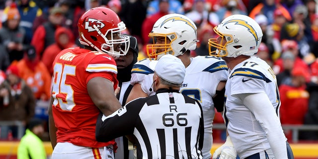 Kansas City Chiefs defensive tackle Chris Jones (95) and Los Angeles Chargers quarterback Philip Rivers (17) arguing during the first half of Sunday's game. (AP Photo/Ed Zurga)