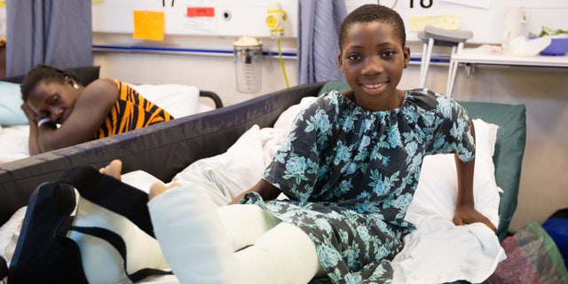 Valerie, pictured recovering after her surgery which took place on board Africa Mercy, said she is excited to see her old classmates again.