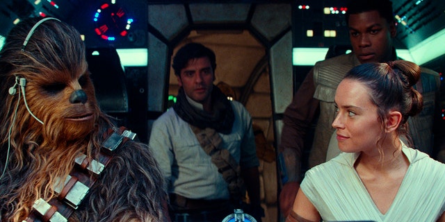 This image released by Disney/Lucasfilm shows, from left, Joonas Suotamo as Chewbacca, Oscar Isaac as Poe Dameron, Daisy Ridley as Rey and John Boyega as Finn in a scene from 