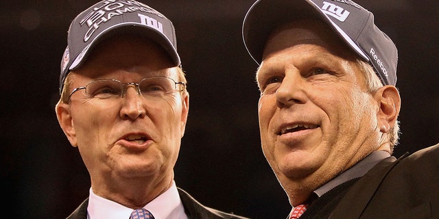 Co-owners John Mara and Steve Tisch of the New York Giants celebrate after defeating the New England Patriots 21-17 during Super Bowl XLVI at Lucas Oil Stadium on Feb. 5, 2012 in Indianapolis, Indiana. (Ezra Shaw/Getty Images)