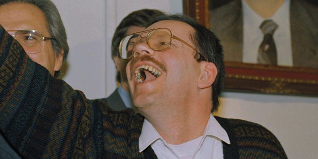 Terry Anderson, chief Middle East correspondent for the Associated Press, waves as he enters a news conference in the Syrian Foreign Ministry in Damascus, Wednesday, Dec. 4, 1991. Anderson was held captive for nearly seven years before being released on Wednesday. (AP Photo/Santiago Lyon)