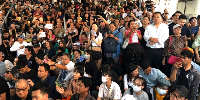 Thailand's Future Forward Party leader Thanathorn Juangroongruangkit talks to his supporters during rally in Bangkok, Thailand, Saturday, Dec. 14, 2019. Several thousand supporters of a popular Thai political party, under threat of dissolution, packed a concourse in central Bangkok on Saturday in one of the largest political demonstrations in recent years.