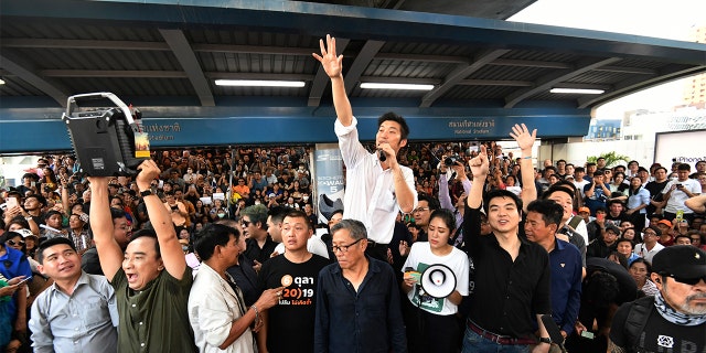 Thailand's Future Forward Party leader Thanathorn Juangroongruangkit talks to his supporters during a rally in Bangkok, Thailand, Saturday, Dec. 14, 2019. Several thousand supporters of a popular Thai political party, under threat of dissolution, packed a concourse in central Bangkok on Saturday in one of the largest political demonstrations in recent years.